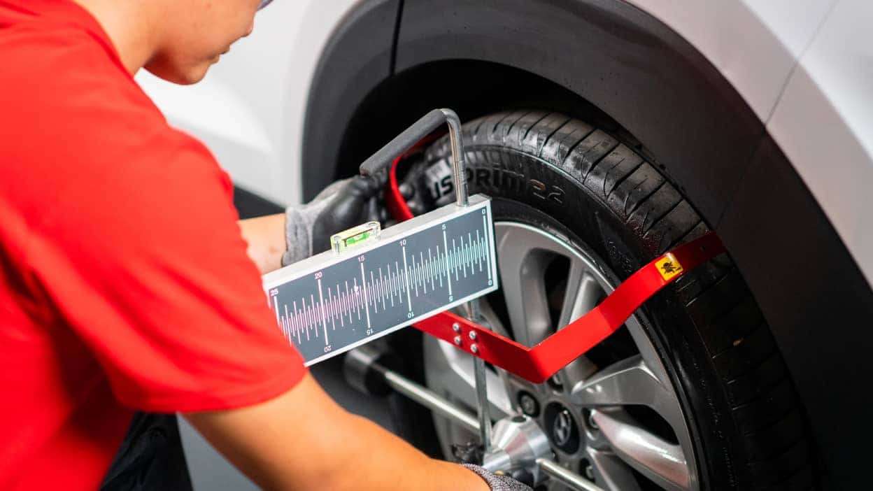 A technician at Autoglass® carrying out a recalibration 