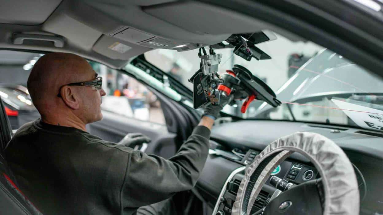 A technician carrying out a recalibration at an Autoglass branch