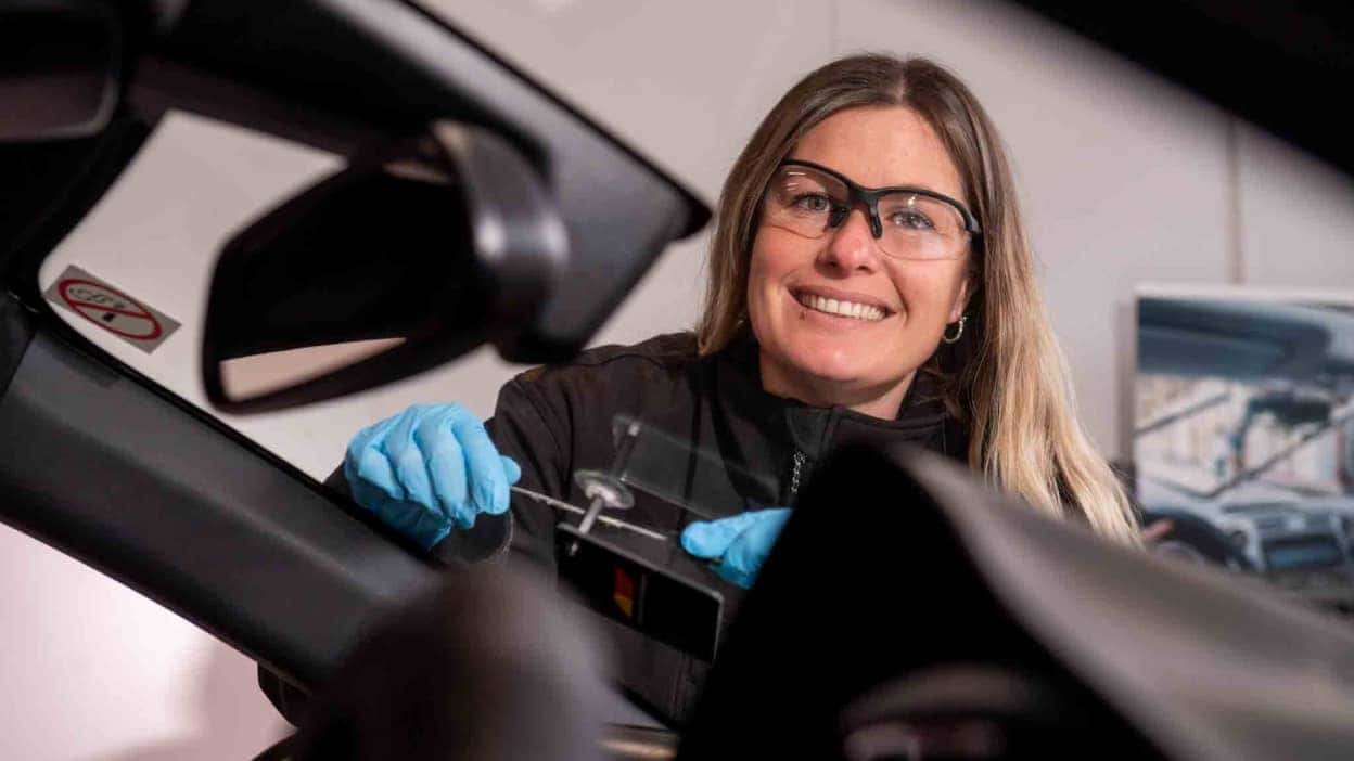 Technician at Autoglass carrying out a repair on a windscreen 